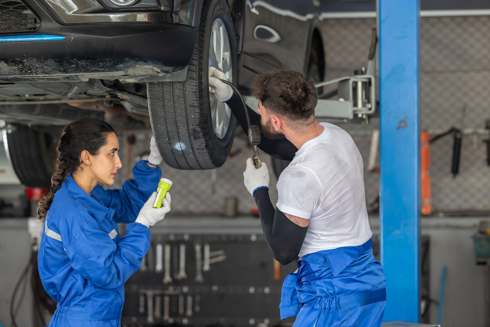 car technicians analyze